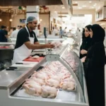 Fresh chicken displayed at a clean poultry market in Ajman.