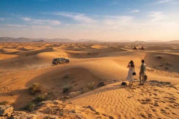 Travelers enjoying a desert experience among Dubai sand dunes