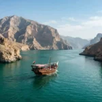 Traditional dhow cruise between Musandam mountains and turquoise waters
