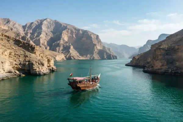 Traditional dhow cruise between Musandam mountains and turquoise waters