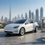 Used Tesla electric car charging at an EV station in Dubai UAE