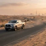 Toyota pickup truck driving in UAE desert